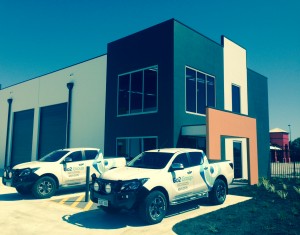 Photo of two Go2 Group trucks outside company offices